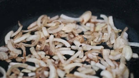 Sizzling Onions Close-up Stock Footage 303706313