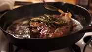 Sizzling Prime Cut T-Bone Steak On Home Cast Iron Skillet 4K 60Fps Stock Footage