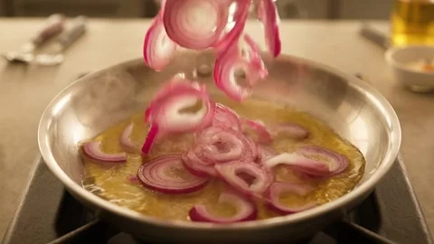 Sizzling Red Onion Rings in a Pan Stock Footage 332661405