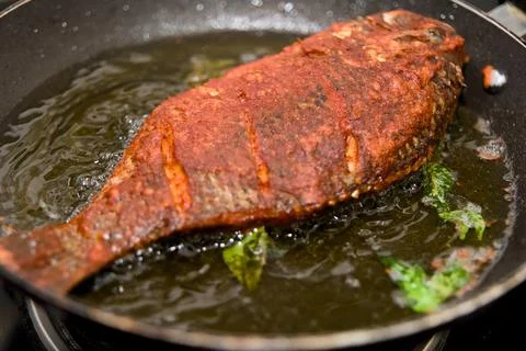 Sizzling Red Snapper Frying Stock Photos