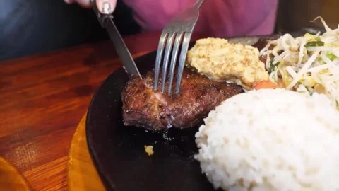 Sizzling Steak Dinner on a Hot Plate 스톡 동영상 332817583