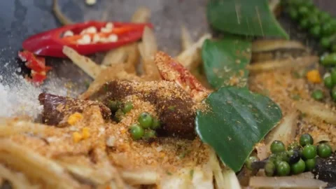 Sizzling Thai Pad Cha Stir-Fry with Fresh Green Peppercorns and Kaffir Lime Leav Stock Footage 338213344