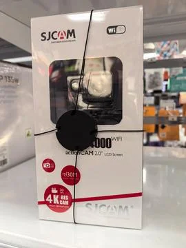 SJCAM action camera box on store shelf with bright lights in the background Stock Photos