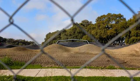 Skate Park Under Construction Seen Through Chain Link Fence Stock Photos