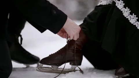 A skate in the snow, a stretched lace creates a contrast of textures. The close- Stock Footage 301300030