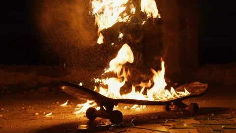 Skateboard on fire, at night Stock Footage 100054988