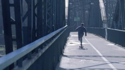 Skateboard guy riding a bridge Stock Footage 106805536