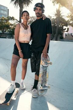 Skateboard, skater couple and city sports while outdoor at a skate park for Stock Photos