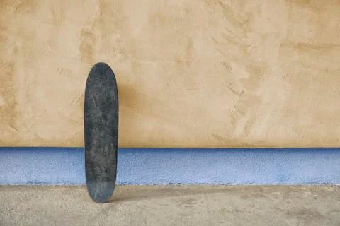 Skateboard on a wall Photos