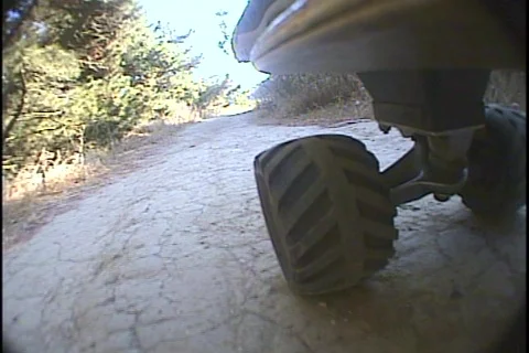 Skateboard wheels roll over a bumpy path. Video stock 339982