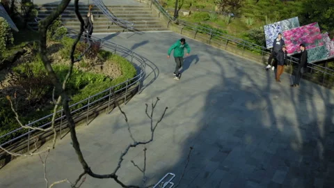 Skateboarder accelerates after which jumps from the stairs 스톡 동영상 94111787