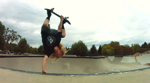 Skateboarder does an invert in slow motion Stock Footage 63771034