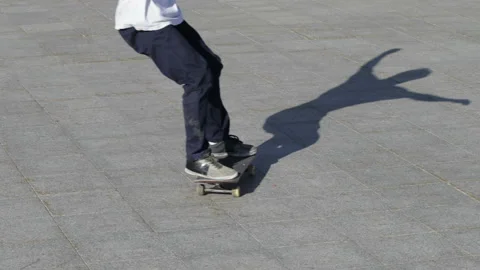 Skateboarder does the slide trick powerslide, or braking on skateboard, slowmo Stock Footage 96726200