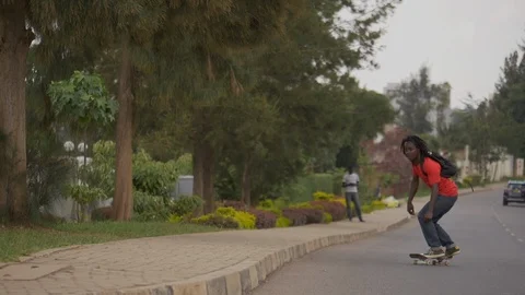 Skateboarder doing double tricks on the grind box in the road in slow motion Stock Footage 113002344