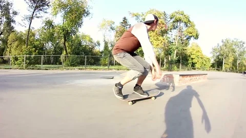 Skateboarder doing a few tricks in the skate park in one line Stock Footage 69789548