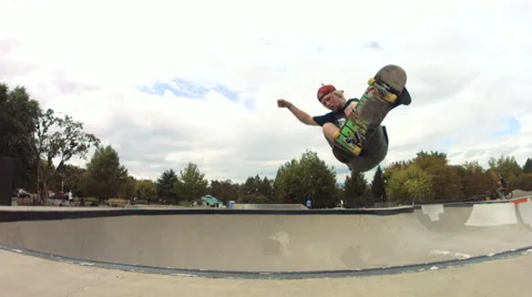 Skateboarder doing a frontside indy grab Video stock 63770779