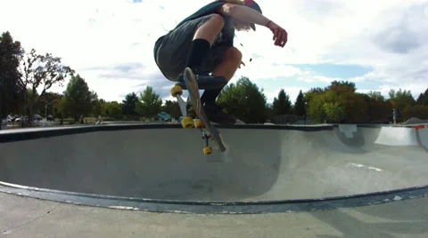 Skateboarder doing a kick flip in slow motion Video stock 63771472