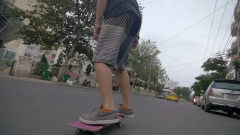 Skateboarder doing a trick on road Stock Footage 73504138