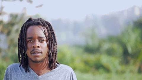 Skateboarder with dreadlocks facing the camera  Stock Footage 112985309