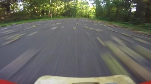 Skateboarder going down road weaving back and forth Stock Footage 53838996