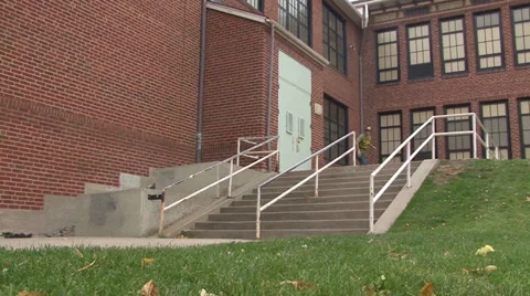 Skateboarder Grinds Down Handrail Stock Footage 27829889