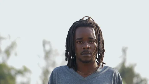 Skateboarder guy smiling facing the camera Stock Footage 112985162