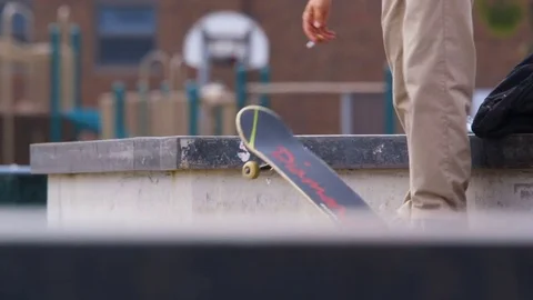 Skateboarder Holding Cigarette Stock Footage 79973022