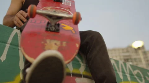 Skateboarder holding a skateboard Stock Footage 61275053