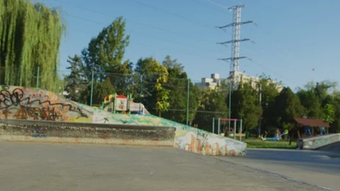 Skateboarder jumping and falling Stock Footage 100054155