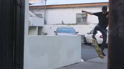 Skateboarder Jumps onto Wall Stock Footage 47323665