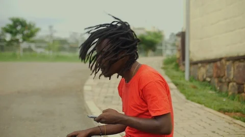  skateboarder moving his dreadlocks  Stock Footage 112998949