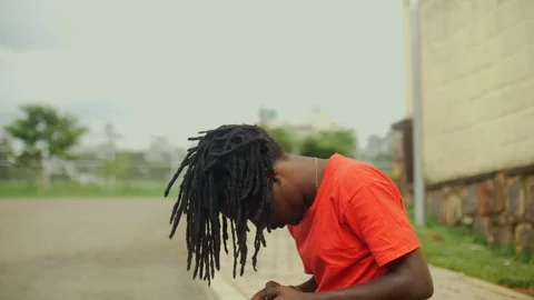  skateboarder moving his dreadlocks  Stock Footage 112999022