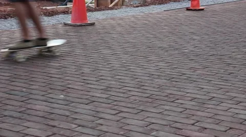 Skateboarder passes work zone Stock Footage 41737745