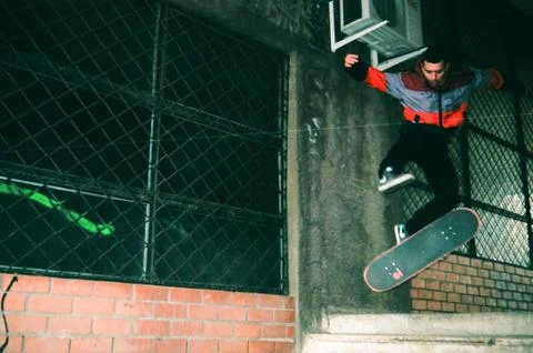 Skateboarder performing 360 flip Stock Photos