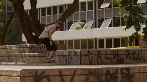 Skateboarder performing skating tricks Stock Footage 61273869
