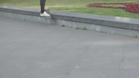 Skateboarder performing a trick at the park Stock Footage 51755828