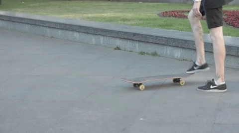 Skateboarder performing a trick at the park Stock Footage 51755880