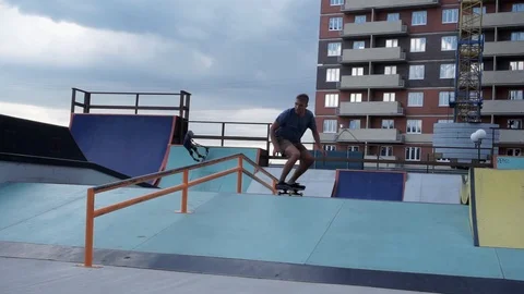 Skateboarder performs trick with sliding Stock-Footage 102248863