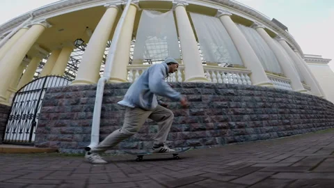 Skateboarder performs tricks in the city Stock-Footage 94114688