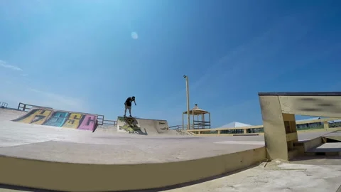 Skateboarder performs tricks in skate park Video stock 94220010