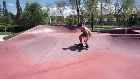 Skateboarder performs tricks in the skate park on the street Video stock 102249937
