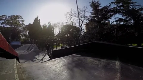 Skateboarder performs various tricks in the skate park 스톡 동영상 94113966