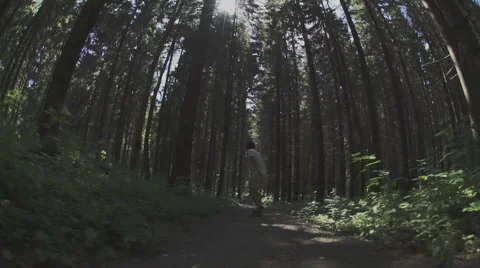 Skateboarder ride in forest Stock Footage 59319149