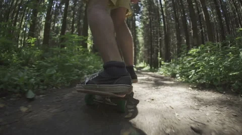 Skateboarder ride in forest Stock Footage 59319227