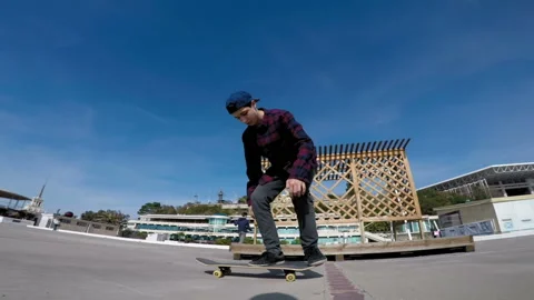 Skateboarder rides and performs tricks Stock-Footage 94200657