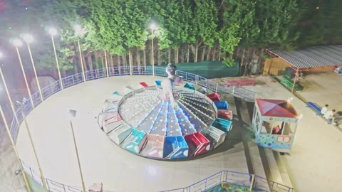 A skateboarder riding a carousel. Stock-Footage 284659791