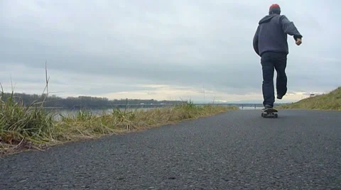Skateboarder on River Trail 1 Stock Footage 8360133