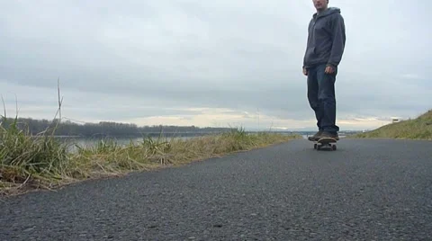 Skateboarder on River Trail 2 Stock Footage 8360140