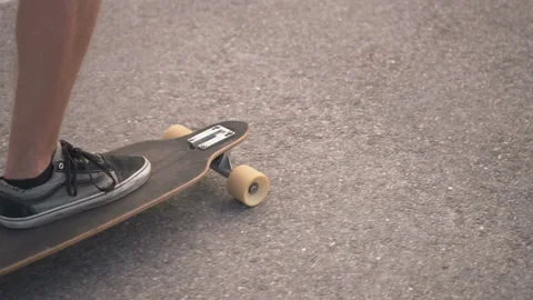 Skateboarder on the Road Stockbeeldmateriaal 91802702