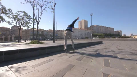 A skateboarder rolls on a big square in downtown in Marseille, France Stock Footage 208892170